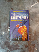 The Counterfeits - Leo F. Kelley