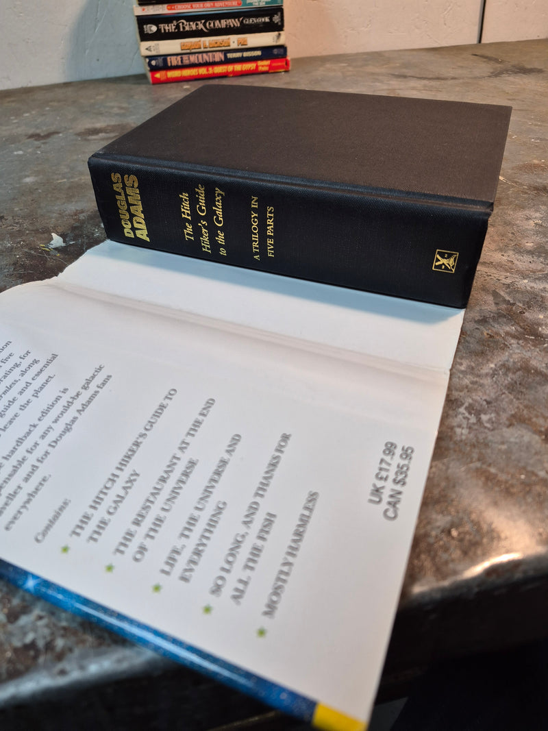 The Hitch Hiker's Guide To The Galaxy: A Trilogy In Five Parts - Douglas Adams